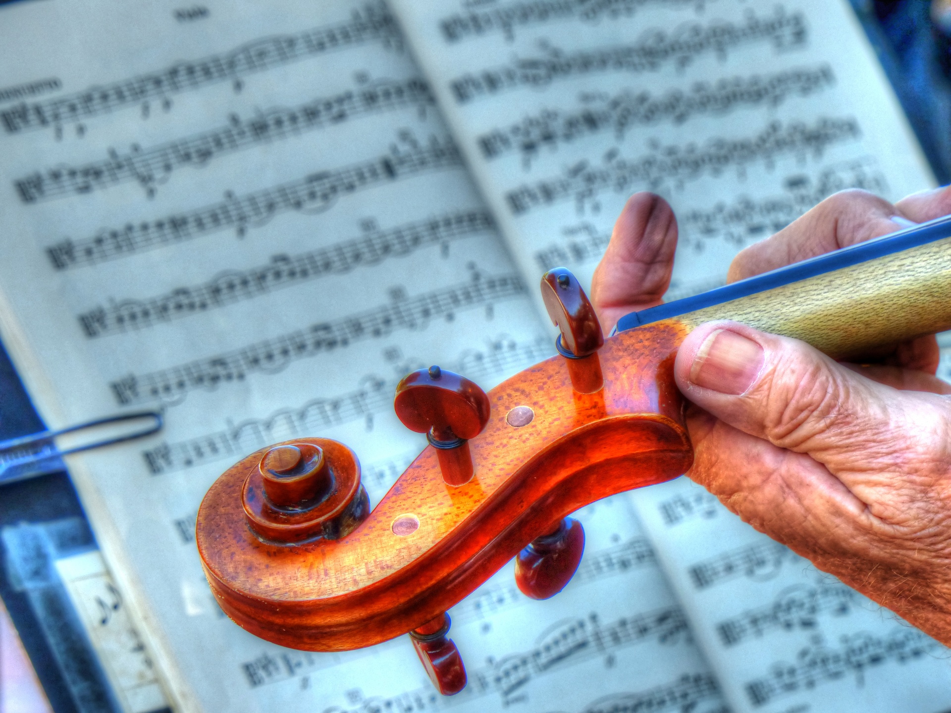 A violin being played by an experienced music maker